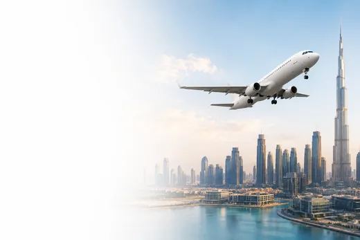 Aircraft taking off over the Dubai skyline